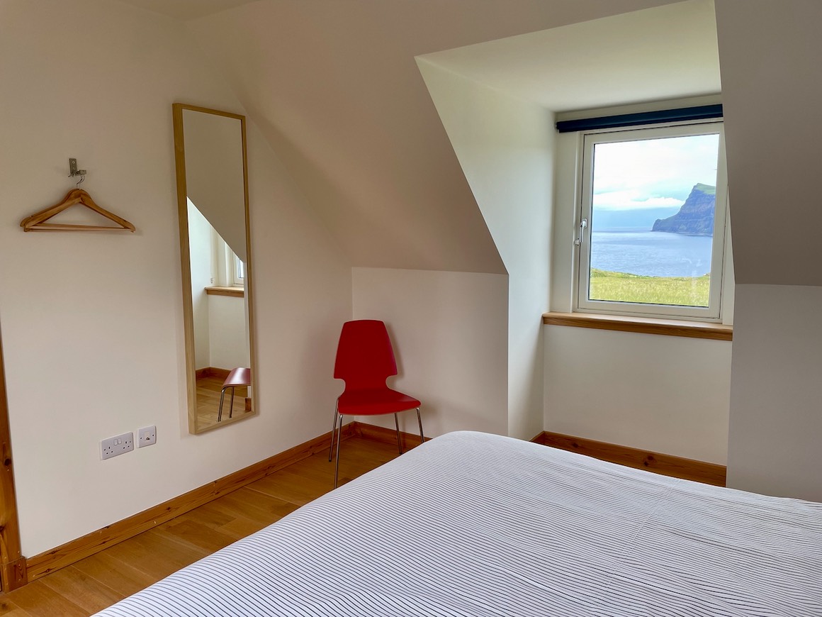 Pooltiel House - upstairs bedroom with super kingsize and seaview